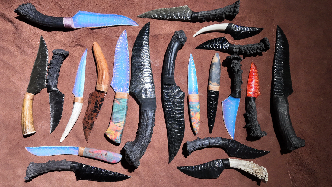 An assortment of handcrafted fantasy daggers and display blades arranged for collectors