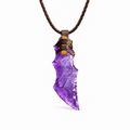 Purple curved blade pendant necklace with brown cord wrapping